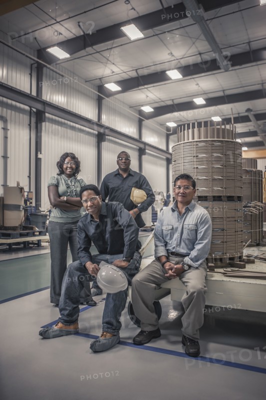 Workers together in factory