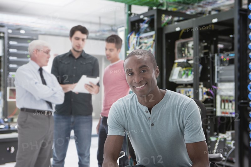 Businessmen in server room