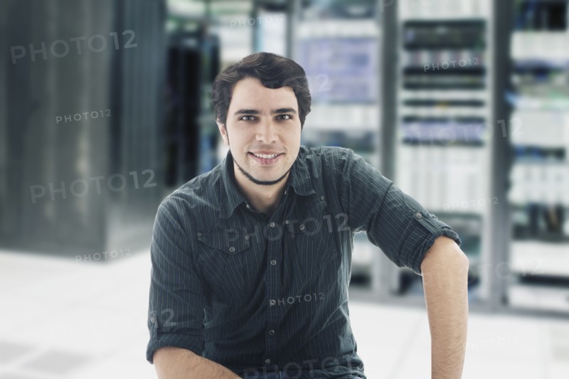 Hispanic businessman in server room