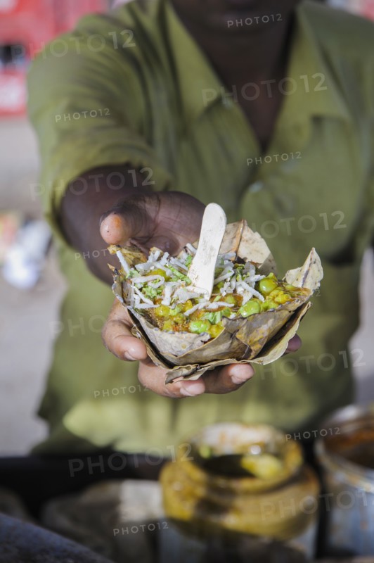 Hand holding bowl of food