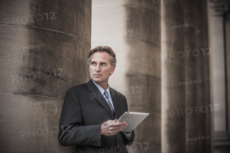 Caucasian businessman using tablet computer