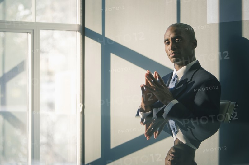 Black businessman sitting at desk