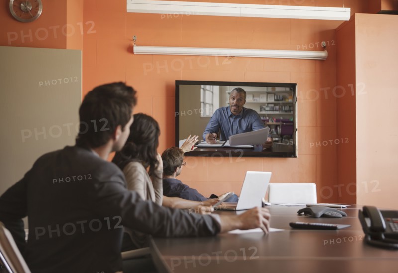 Business people having teleconference in meeting