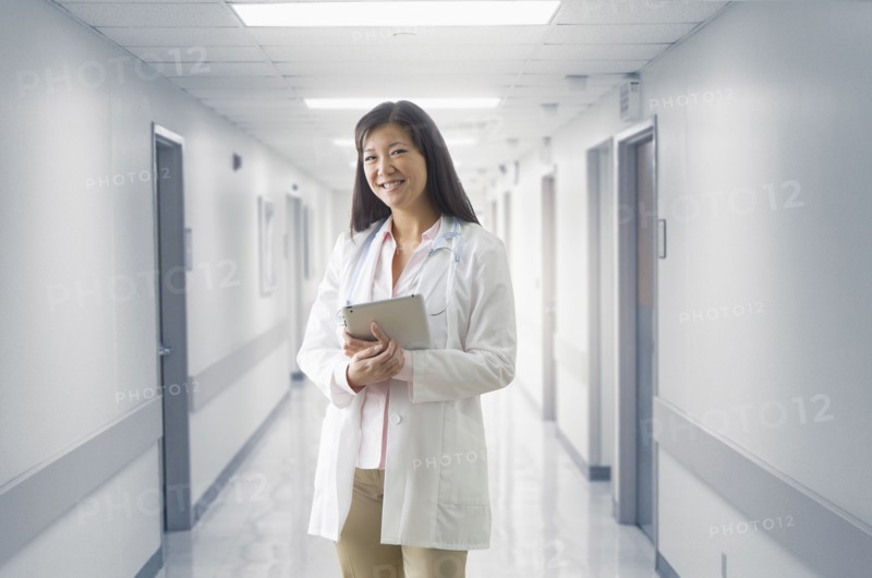 Asian doctor smiling in hospital