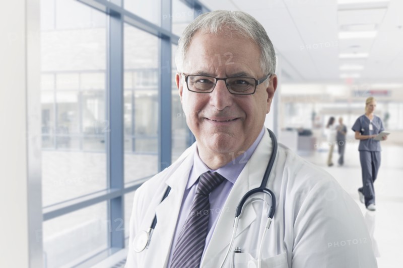 Caucasian doctor smiling in hospital