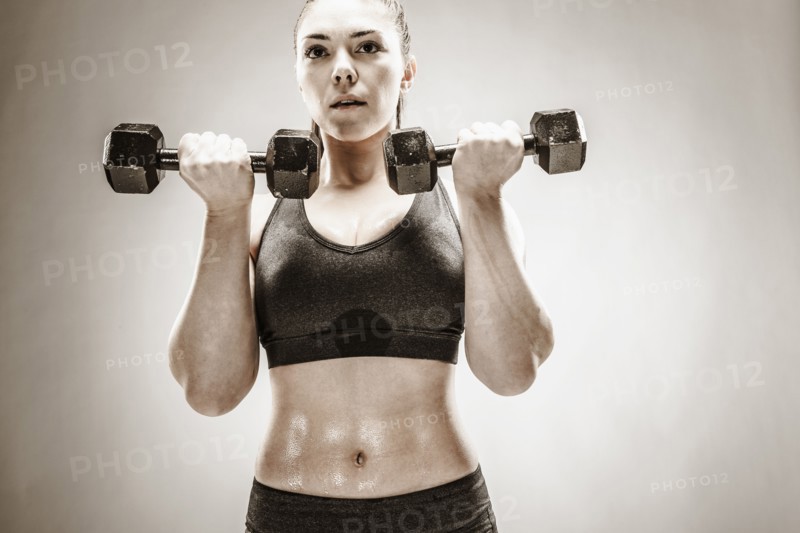 Caucasian woman lifting weights