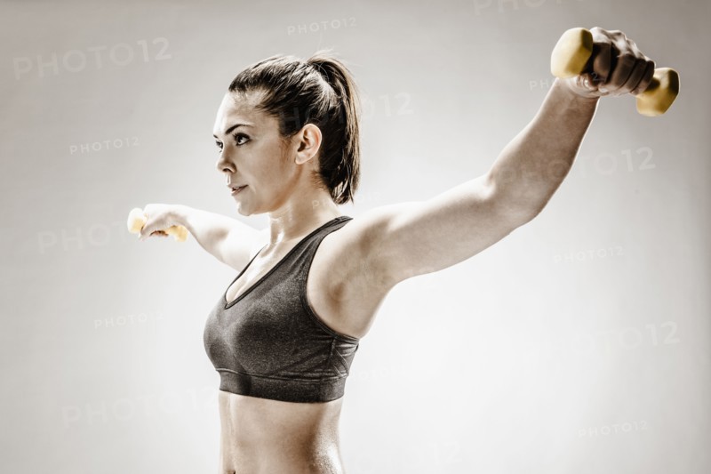 Caucasian woman lifting weights