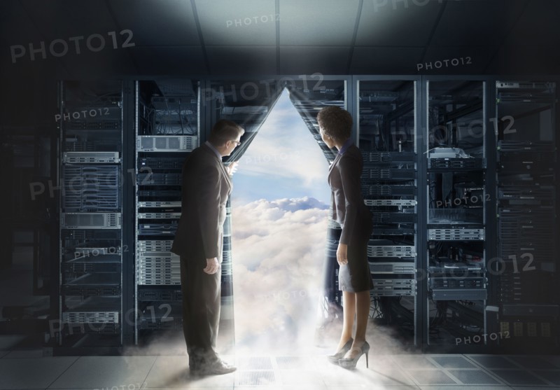 Business people pulling back curtain to clouds