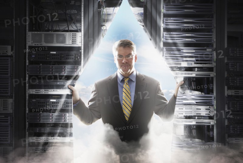 Caucasian businessman pulling back curtain to clouds