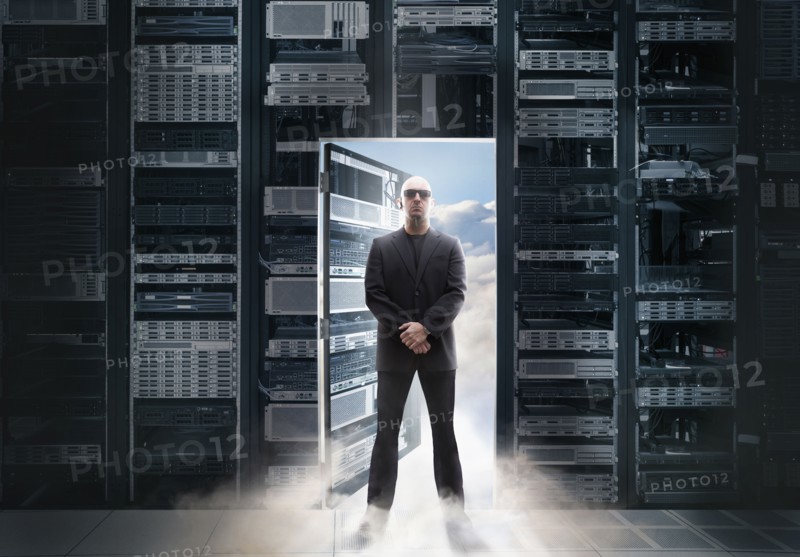 Caucasian man standing in doorway to clouds