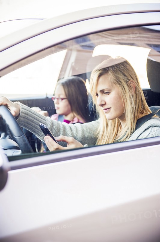 Woman texting and driving