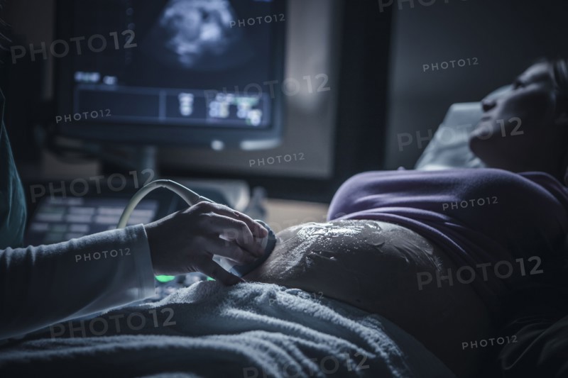 Pregnant woman having sonogram