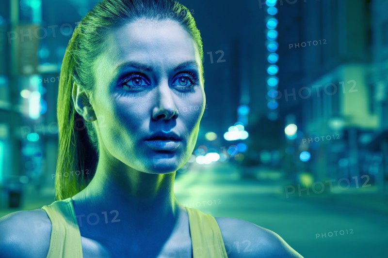 Caucasian runner standing on city street