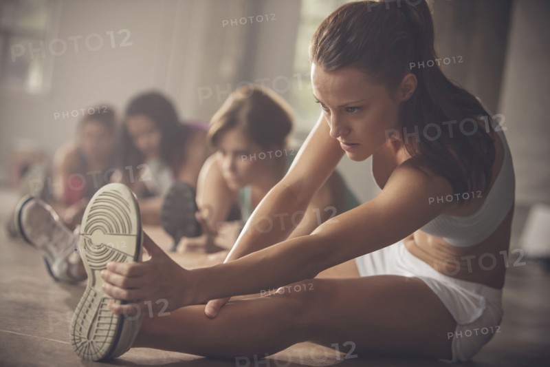 Women stretching in gym