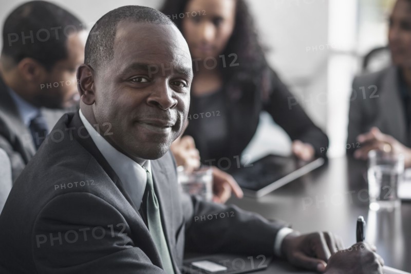 Businessman smiling in meeting