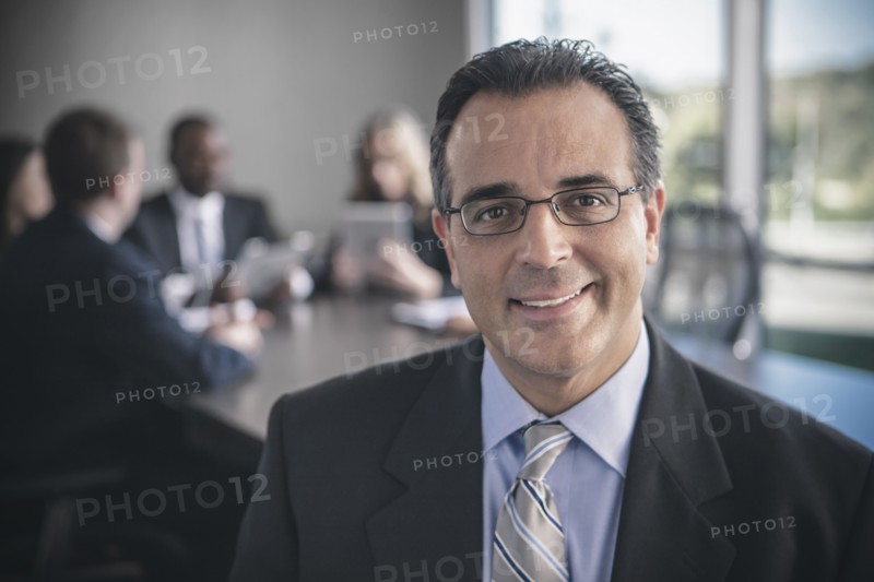 Businessman smiling in conference room