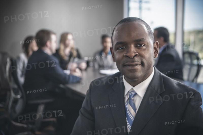 Businessman smiling in conference room