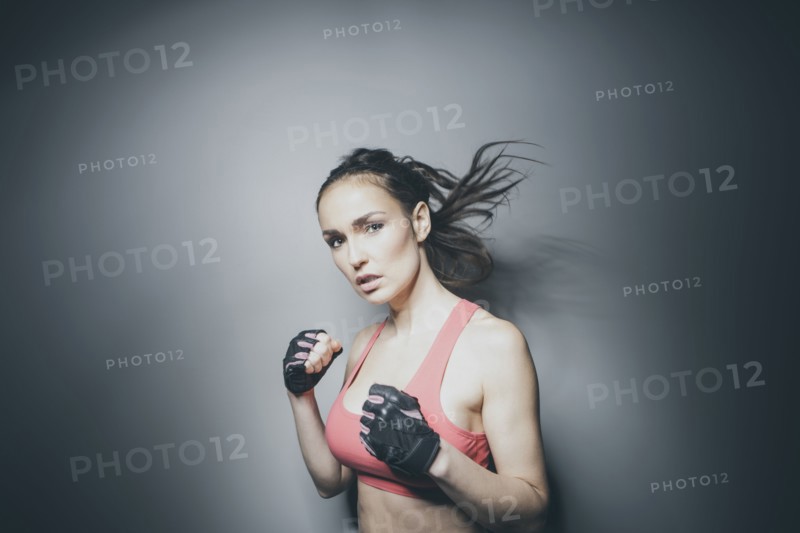 Portrait of Caucasian woman in fighting stance