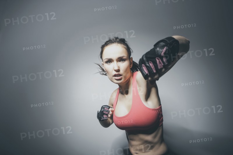 Portrait of Caucasian woman in fighting stance
