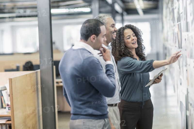 Business people using digital tablet in office