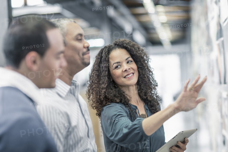 Business people using digital tablet in office