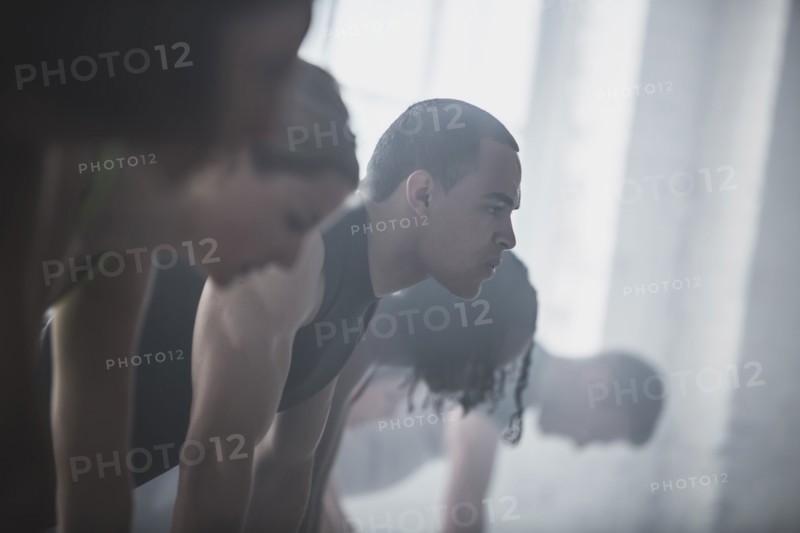 Close up of athletes looking down