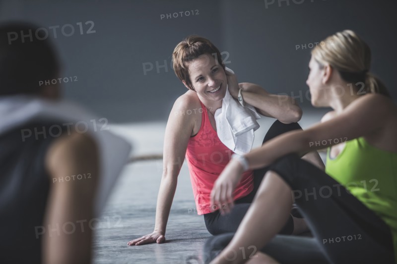 Athletes resting on floor