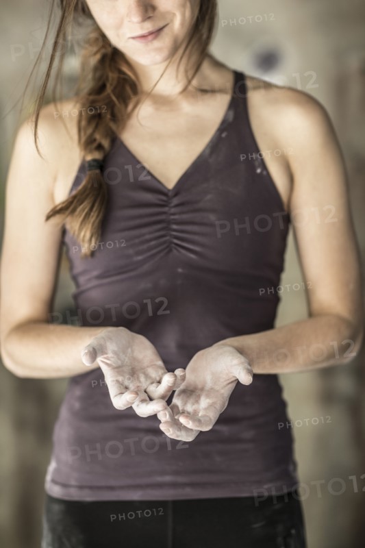 Close up of chalky hands of athlete in gym