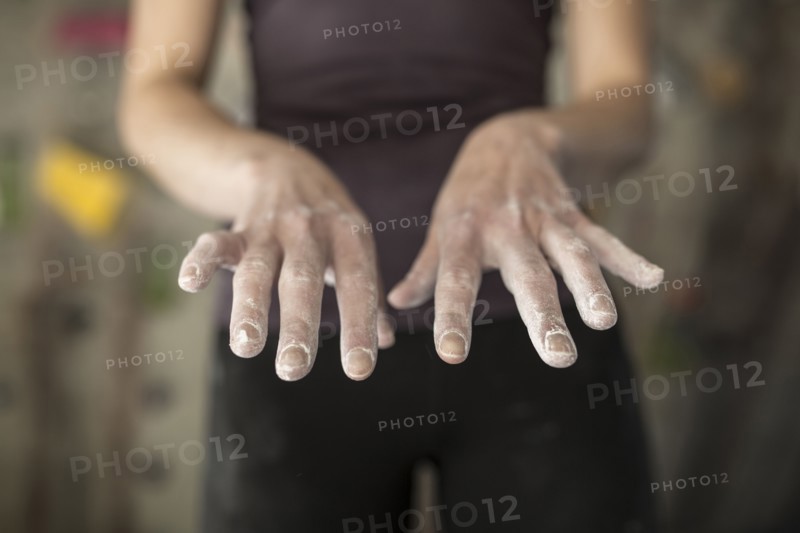 Close up of chalky hands of athlete in gym