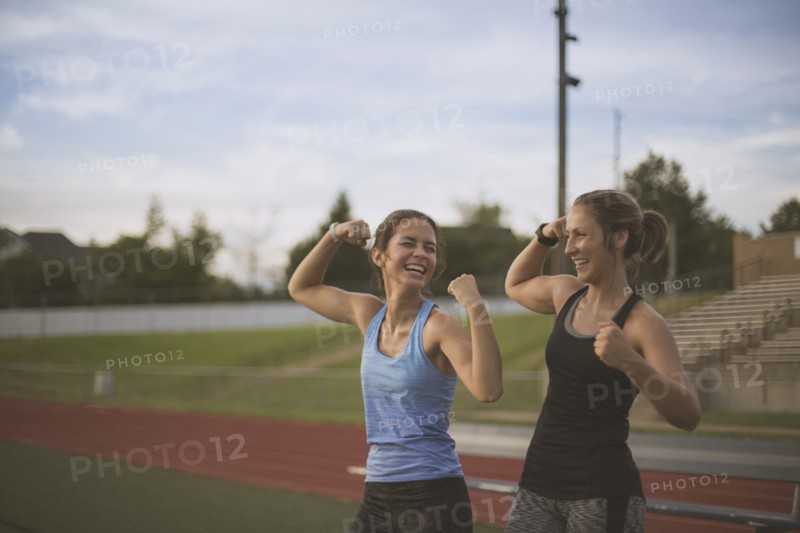 Athletes flexing their muscles on sports field