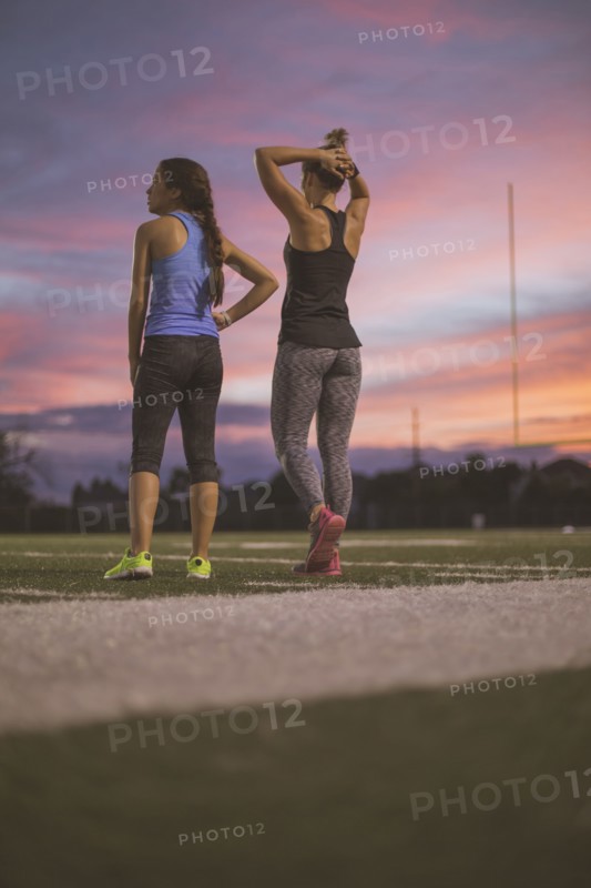 Athletes resting on sports field