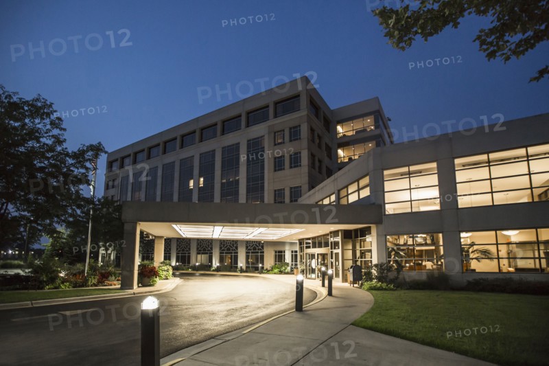Illuminated driveway of hospital at night