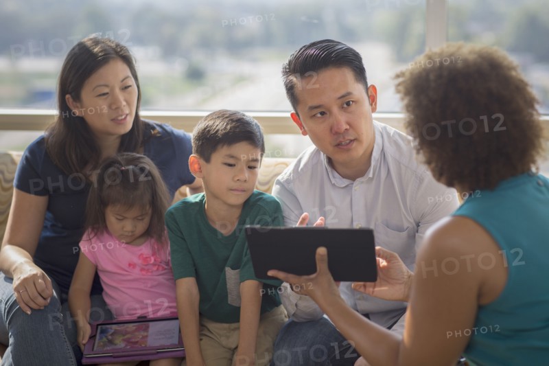 Doctor and patients using digital tablet