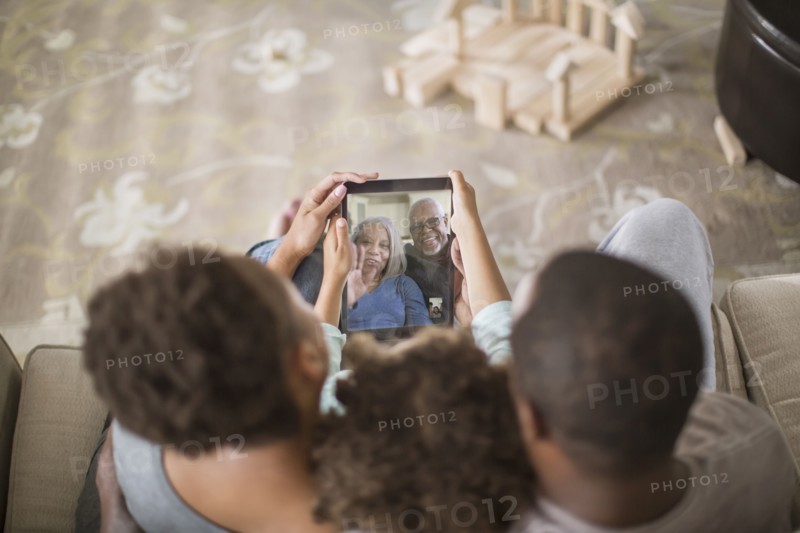 Family video chatting with digital tablet