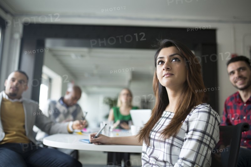 Business people listening in office meeting