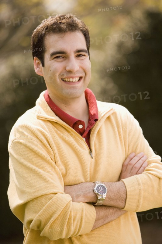 Hispanic man with arms crossed