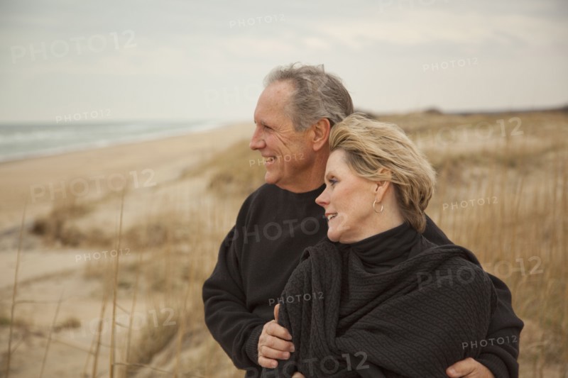 Caucasian couple standing on beach
