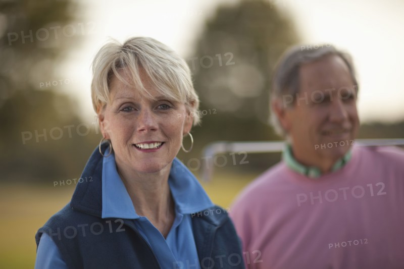 Couple standing on golf course