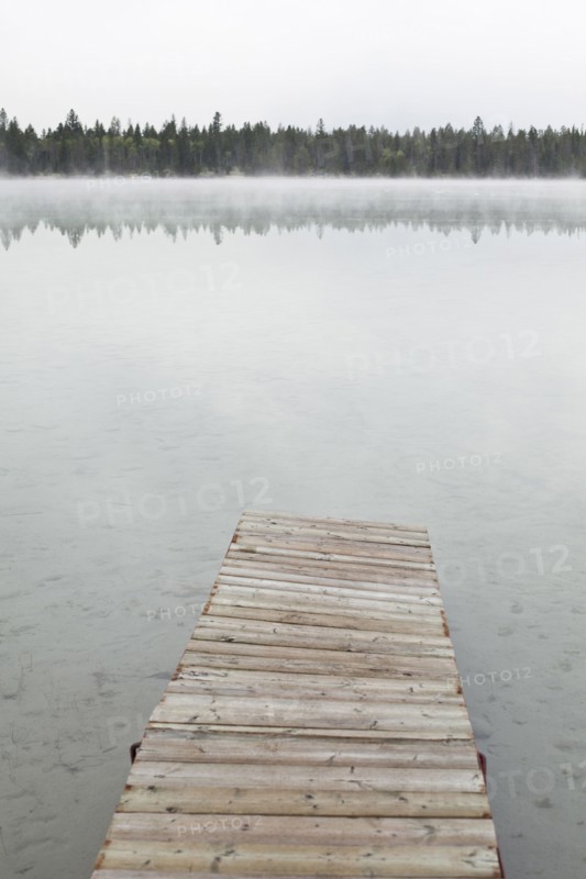 Dock on foggy lake