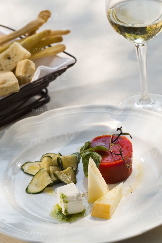 Italian cheese plate with tomato aspic