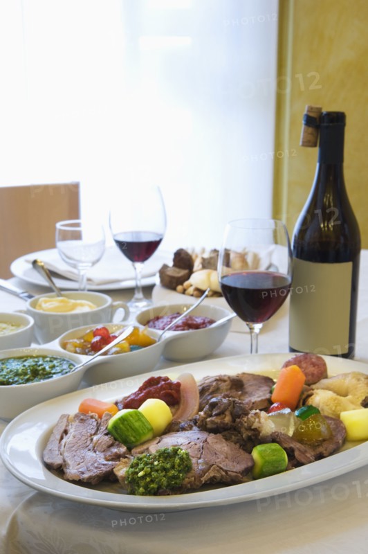 Beef and vegetables dinner with wine