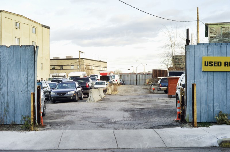Cars parked in urban lot