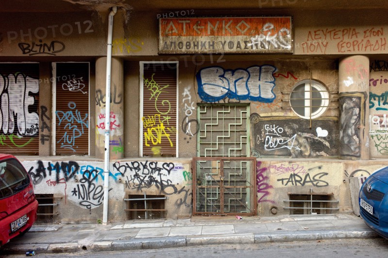 Graffiti covering urban wall in city