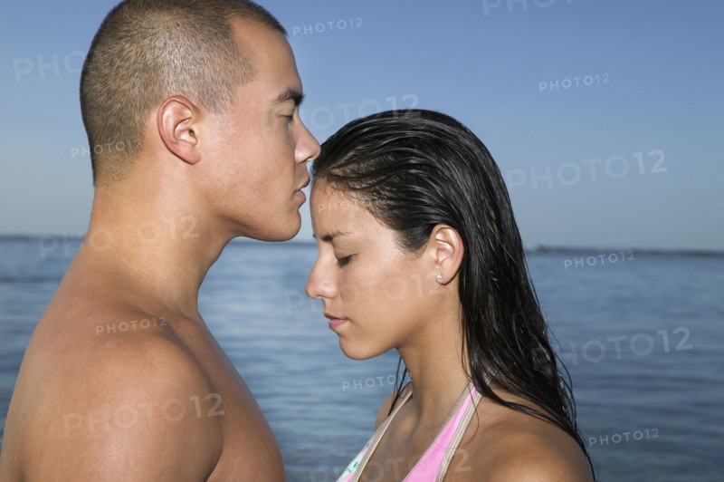 Multi-ethnic couple with eyes closed