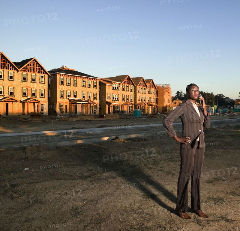 African American businesswoman at residential construction site