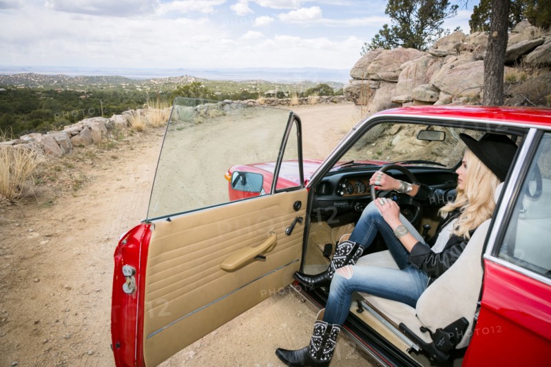 Caucasian woman admiring scenic view from car