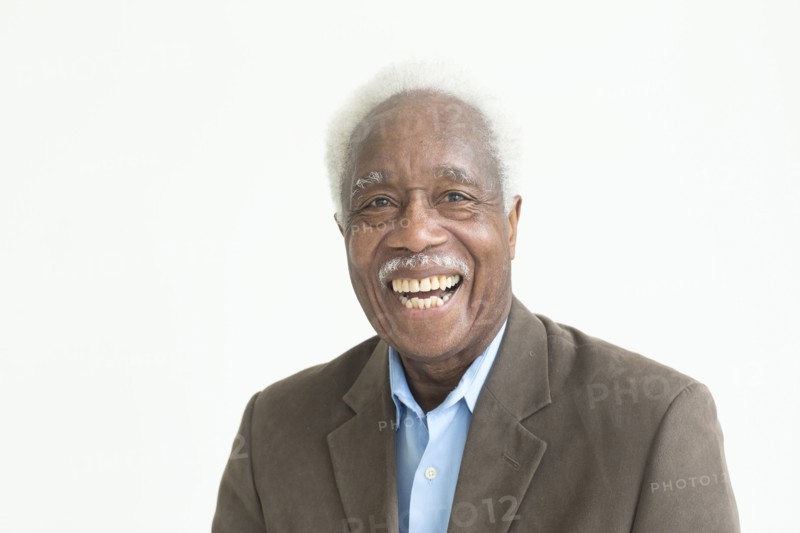 Portrait of laughing older Black man