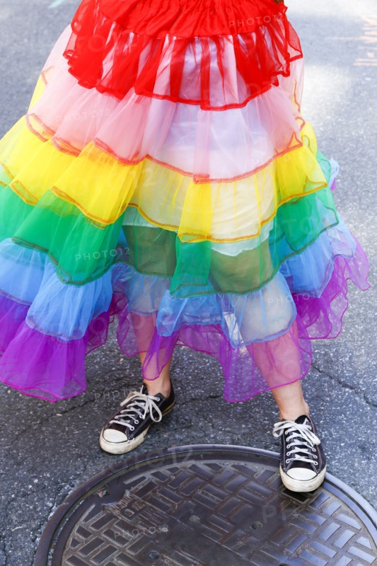 Person wearing rainbow skirt