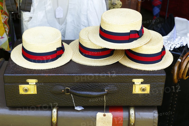 Straw hats on old-fashioned briefcase