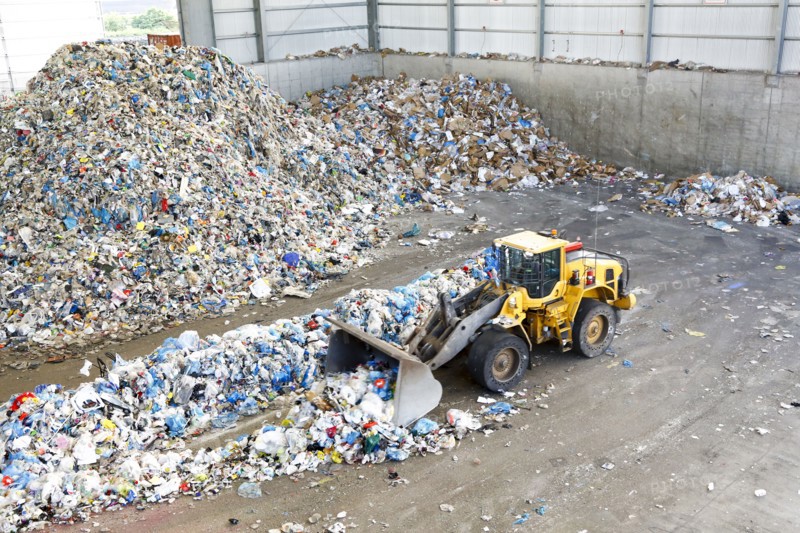 Bulldozer pushing trash